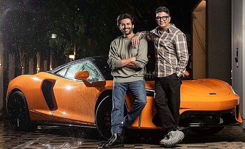 Kartik Aaryan and Bhushan Kumar posing with the new McLaren GT