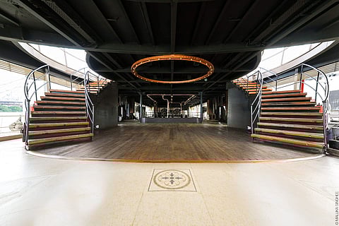 One of the decks of The Bengal Paddle with a grand staircase