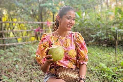 Mira also shared a snap of her sipping coconut water amidst trees and other vegetation