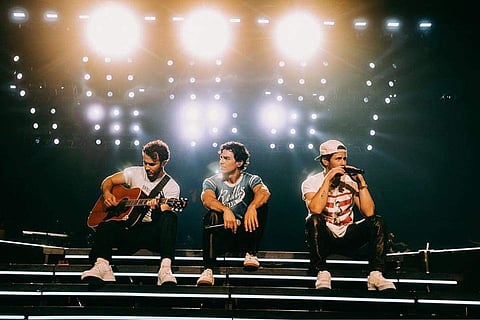 Jonas Brothers belt out classic Eagles track with their dad on stage