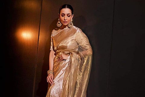 Malaika Arora radiates elegance in a Manish Malhotra gold sari for her 48th birthday