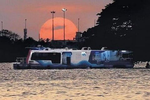 The beautiful scenery of sun setting in the backdrop of water metro sailing between the High Court-Vypeen route. (Photo | T P Sooraj, EPS)