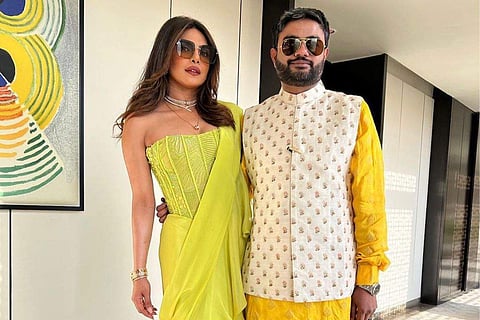 Priyanka accessorised her sari with a tiered diamond choker necklace and pendant chain