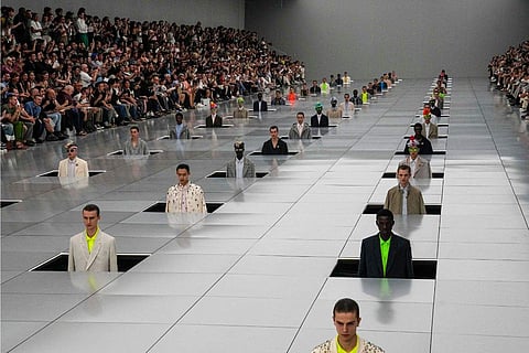 Models wear creations for the Dior Menswear Spring/Summer 2024 fashion collection presented in Paris