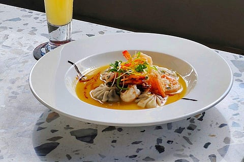 In frame: Garlic Butter Prawns with Dumplings