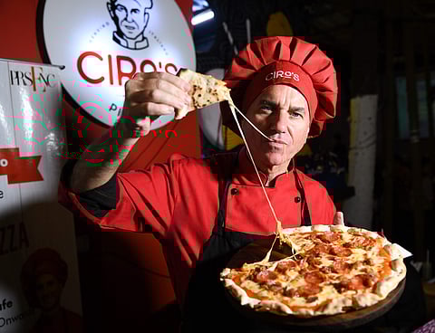 Chef Ciro with wood-fired Pizza
