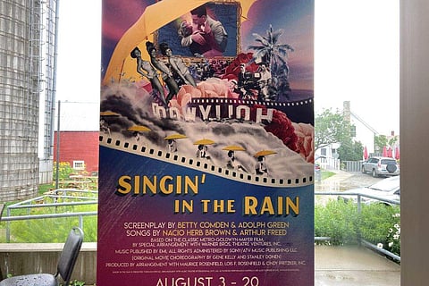 A poster for the Weston Theater Company's production of 'Singin' in the Rain' hangs in the company's smaller Walker Farm venue