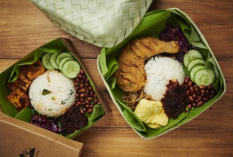 Nasi Lemak in handwoven rattan boxes ready for takeaway