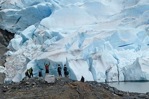 A group of people take in the views of the Mendenhall Glacier