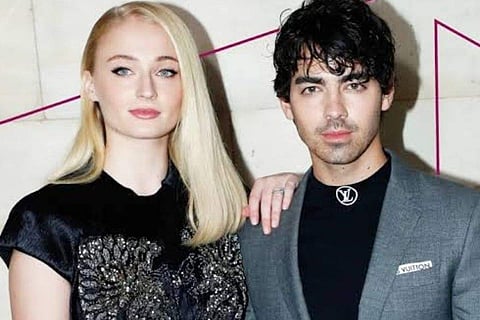 Joe Jonas wells up on stage before singing song he wrote for estranged wife Sophie Turner