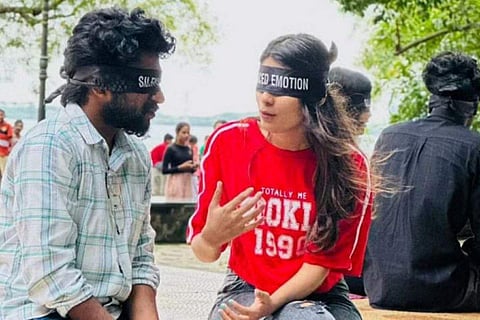 Participants are blindfolded as part of 'silenced emotions' and paired with another person, allowing them to engage in open, judgement-free conversations. (Photo | Express)