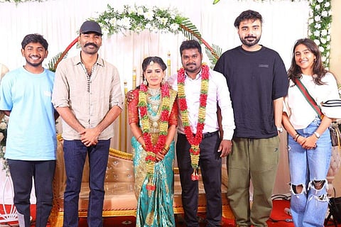 In frame: Dhanush posing with the bride and groom at the wedding