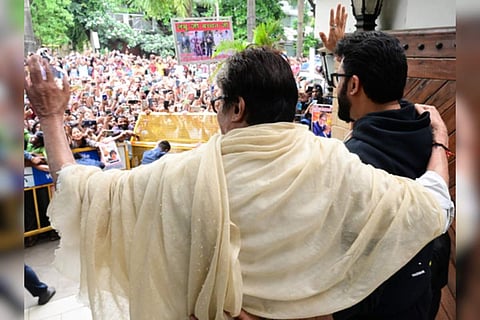 Father-son duo Amitabh, Abhishek Bachchan greet fans outside home