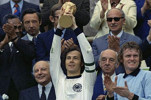 In frame: Franz Beckenbauer lifting the FIFA World Cup