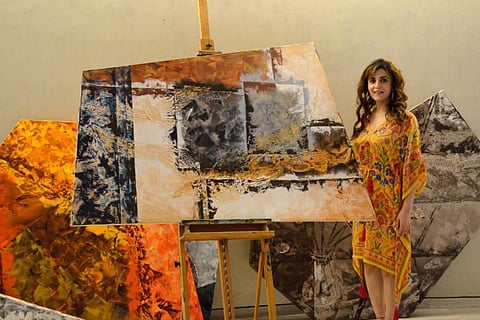 Anita with an artwork