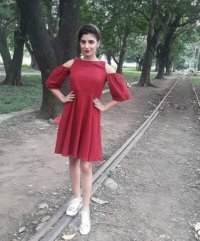 Model Rachel White in a cold shoulder short dress from <g class=