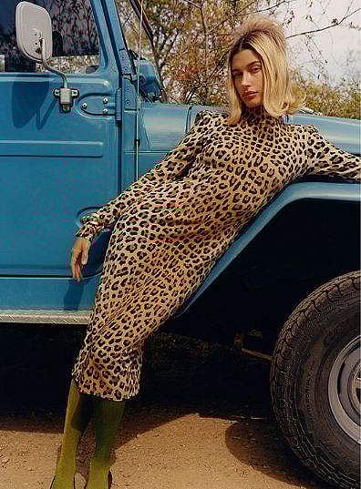 A perfectly flipped ponytail with a velvet bow, Hailey Bieber combines a number of ’90s trends with this look.