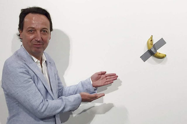 <em>Emmanuel Perrotin poses next to Comedian (Siobhan Morrissey via AP)</em>