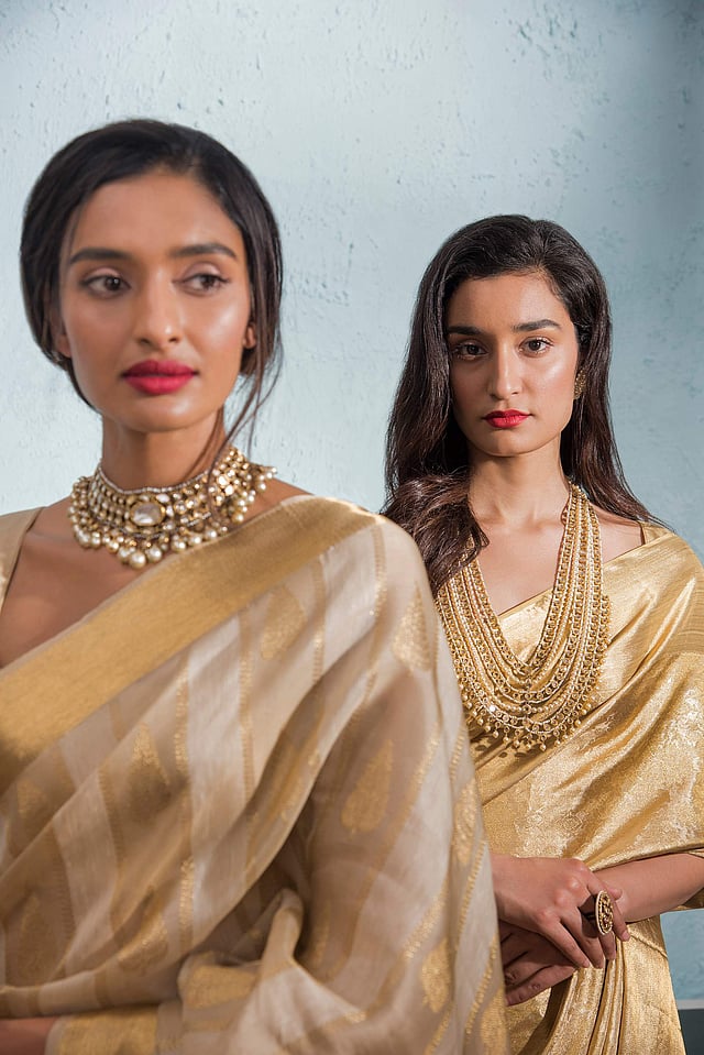 Models in saris from the collection