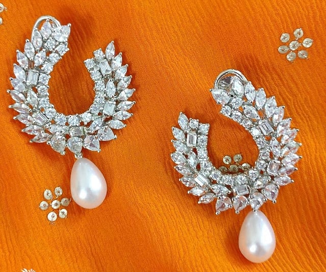 <em>American diamond and pearl chandbali from Nive</em>