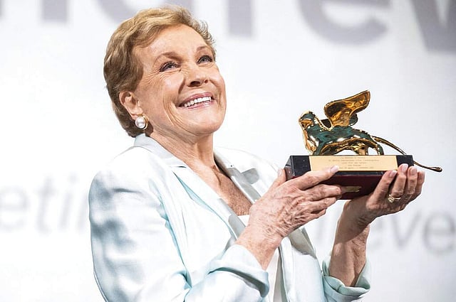 <em>Actress Julie Andrews kisses her Golden Lion for Lifetime Achievement awarded at the 76th edition of the Venice Film Festival (Photo by Arthur Mola/Invision/AP)</em>