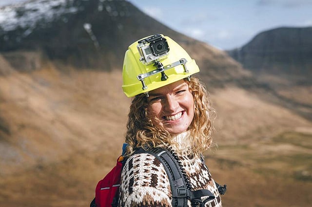 <em>A tour guide for Visit Faroe Islands wears a helmet with a live-streaming camera (Kirstin Vang/Visit Faroe Islands via AP)</em>