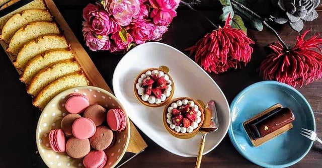Signature lemon loaf,  pistachio and strawberry frangipane tart, chocolate and salted caramel log and macarons