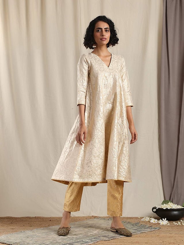 <em>Beige gold modal silk flared kurta pant set, Rs 4,499</em>