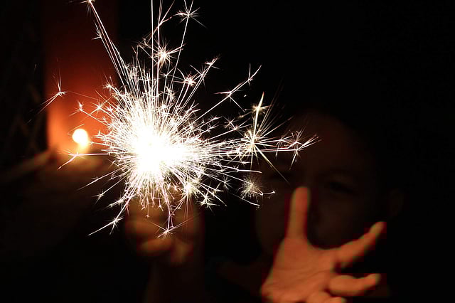 A lit sparkler on Diwali
