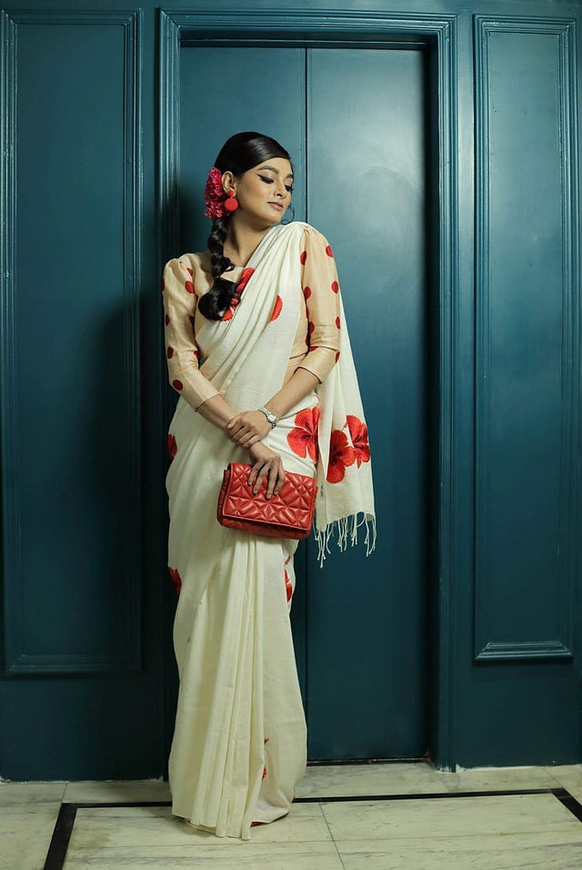 <em>A simple cotton floral sari and polka-dotted puff sleeve blouse by Parama Ghosh</em>