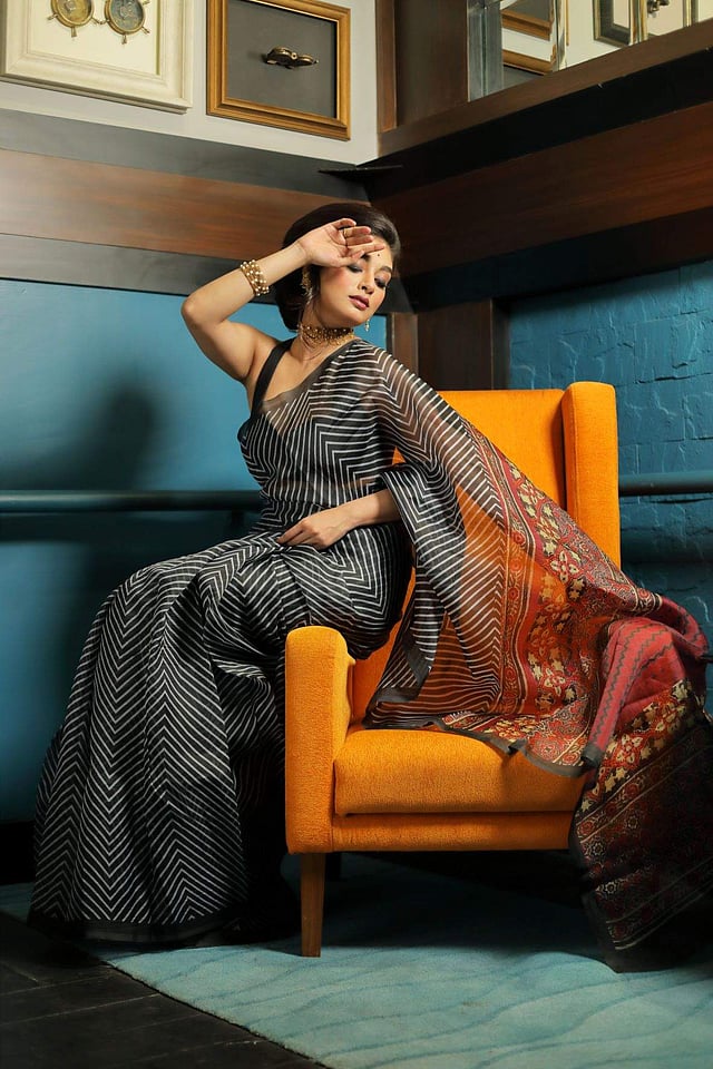 <em>A striped sari from Simmaya with monotone sleeveless blouse</em>