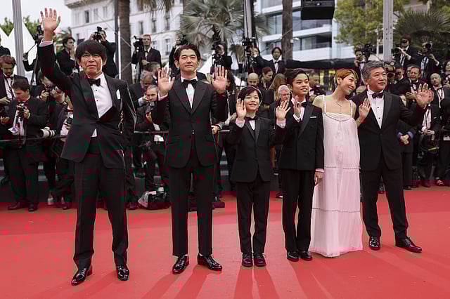 <strong>Yuji Sakamoto, from left, Eita Nagayama, Hiiragi Hinata, Soya Kurokawa, Sakura Ando and director Hirokazu Koreeda pose for photographers upon arrival at the premiere of the film <em>Monster</em></strong>