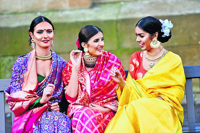 Handwoven <em>Banarasi</em> silk <em>saris</em>; and (in yellow) handwoven <em>Kanjeeveram </em>silk <em>sari</em>